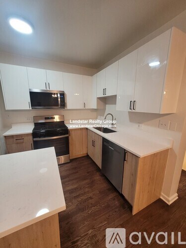 A kitchen with wooden cabinets and a white countertop.