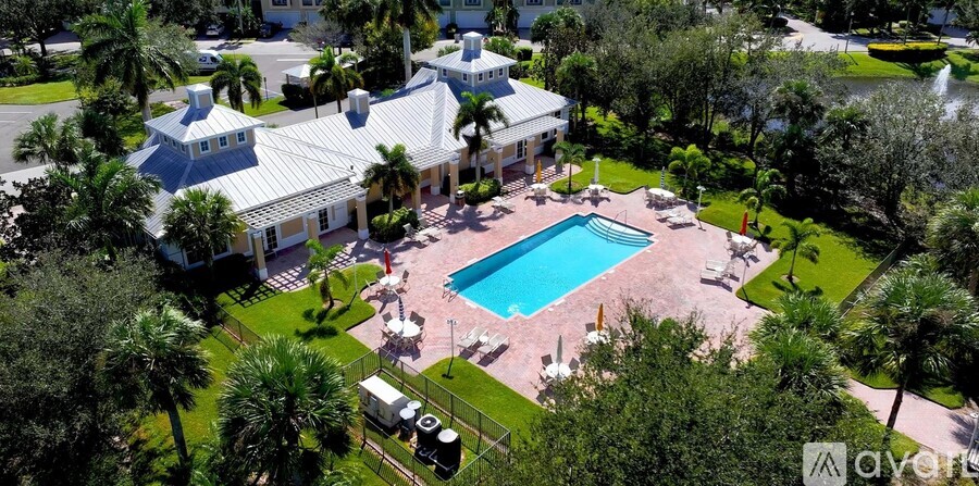 A large house with a pool in the backyard.