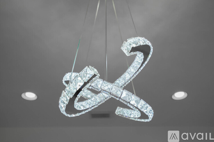 A large, sparkling chandelier with a number 2 design hangs from the ceiling.