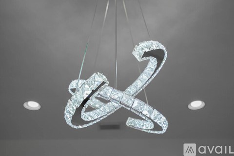 A large, sparkling chandelier with a number 2 design hangs from the ceiling.
