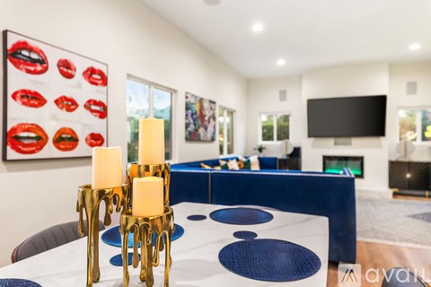 A living room with a blue couch and a television.