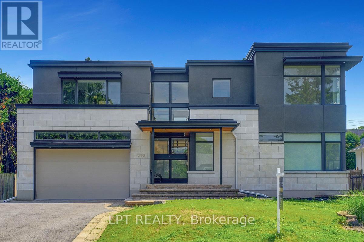 A modern house with a grey and black exterior is for sale.