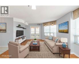 A living room with a couch, chair, and coffee table.
