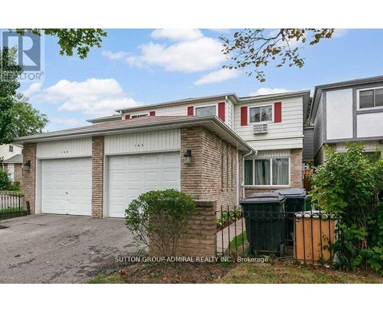 A house with a red stripe on the window and a garage door.