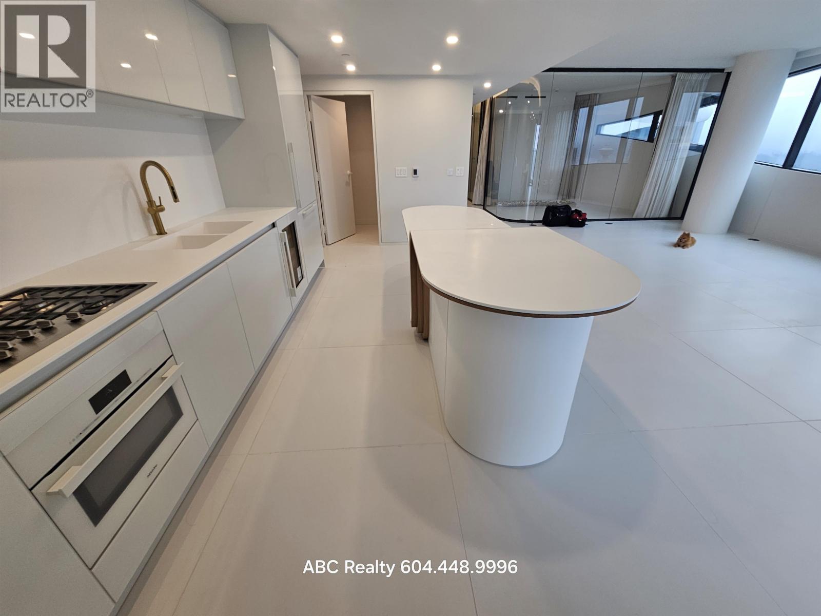 A modern kitchen with a large island in the middle.