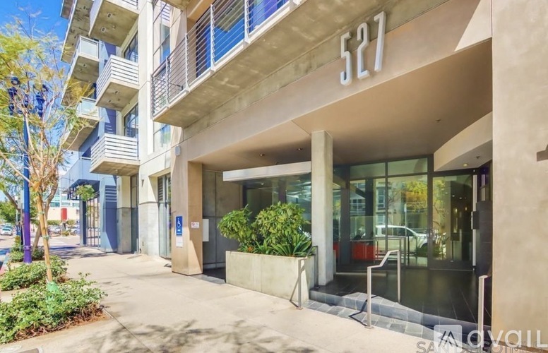 The image shows the front of a building with the number 527 on it.
