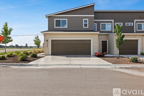 A modern house with a garage is available for sale.