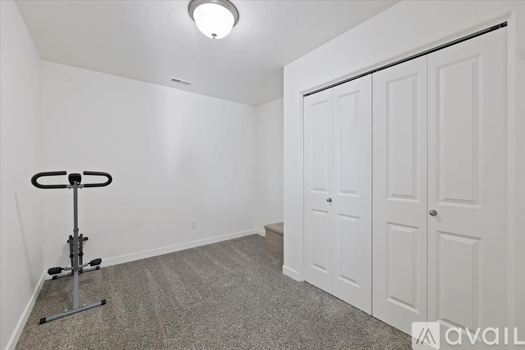 A room with a gym equipment on the floor.