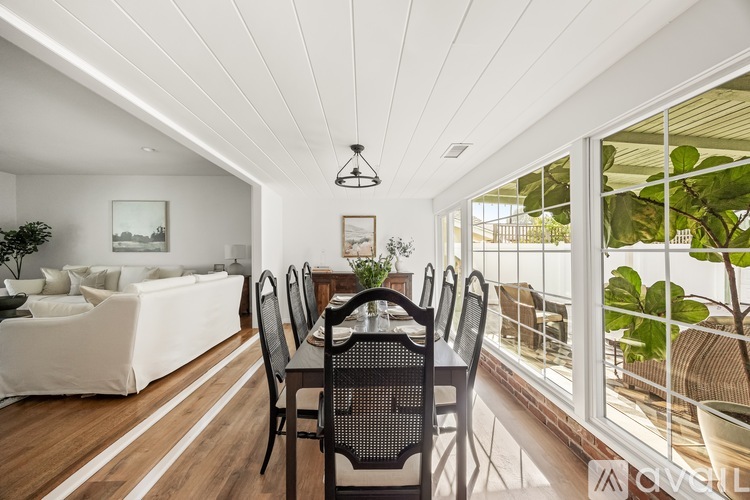 A dining room with a table and chairs is shown.