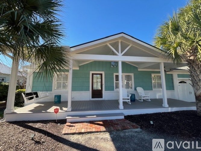 A house with a porch and a swing is for sale.