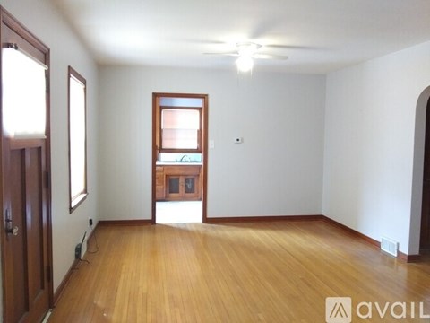 A room with wooden floors and a window.