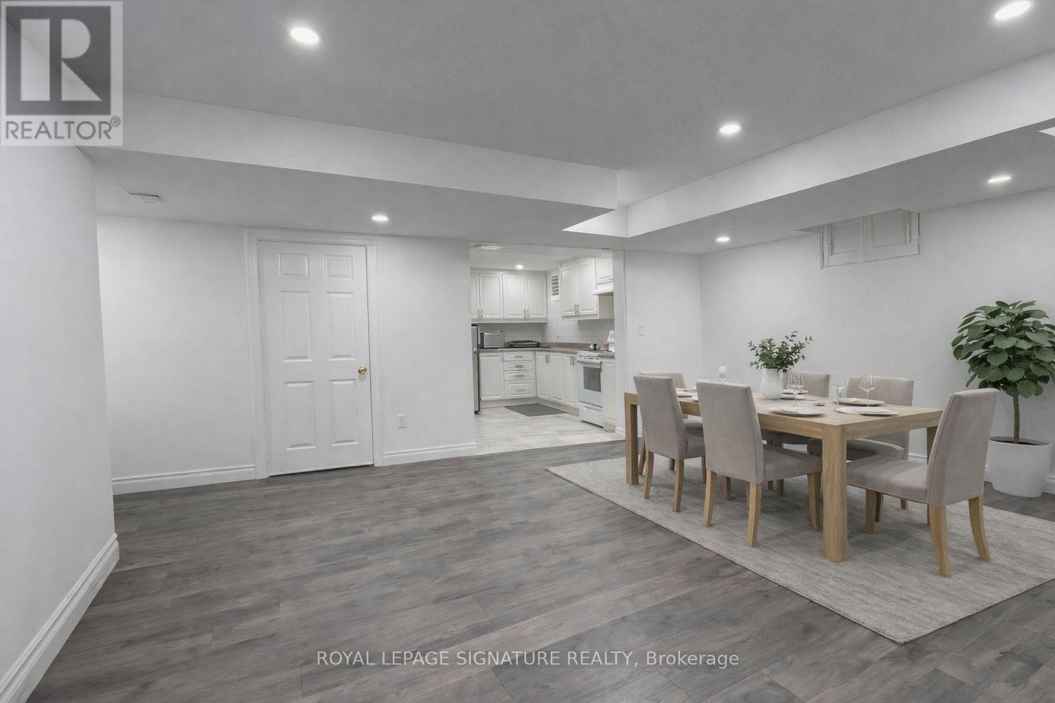A dining room with a table set for four.