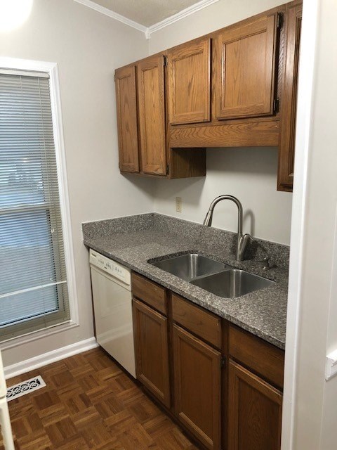 A kitchen with wooden cabinets and a granite countertop.