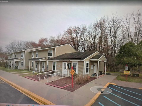 A building with a red stop sign in front of it.