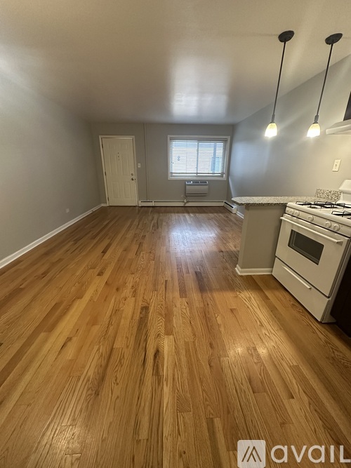 A kitchen with a stove and a window.