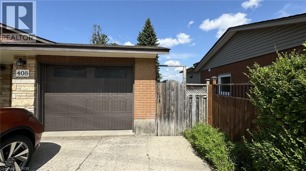 A house with a garage door and a car parked in front.