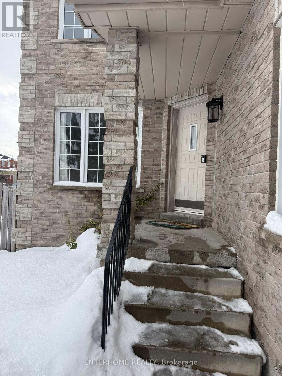 A house with a white door and a snow-covered staircase.