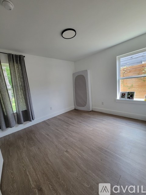 A room with a window and a speaker in it.
