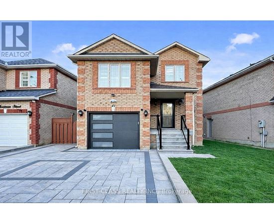 A brick house with a garage door is for sale.