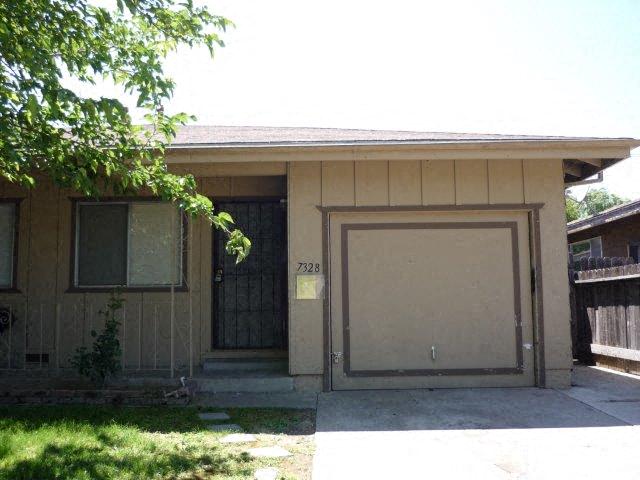 a garage door on the side of a house
