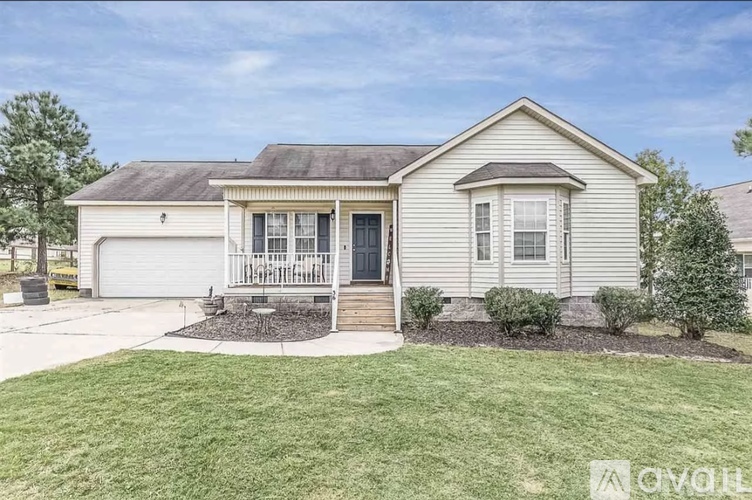 A single-story house with a front porch and a garage.