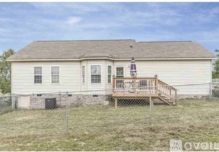 A house with a porch and a flag on it.
