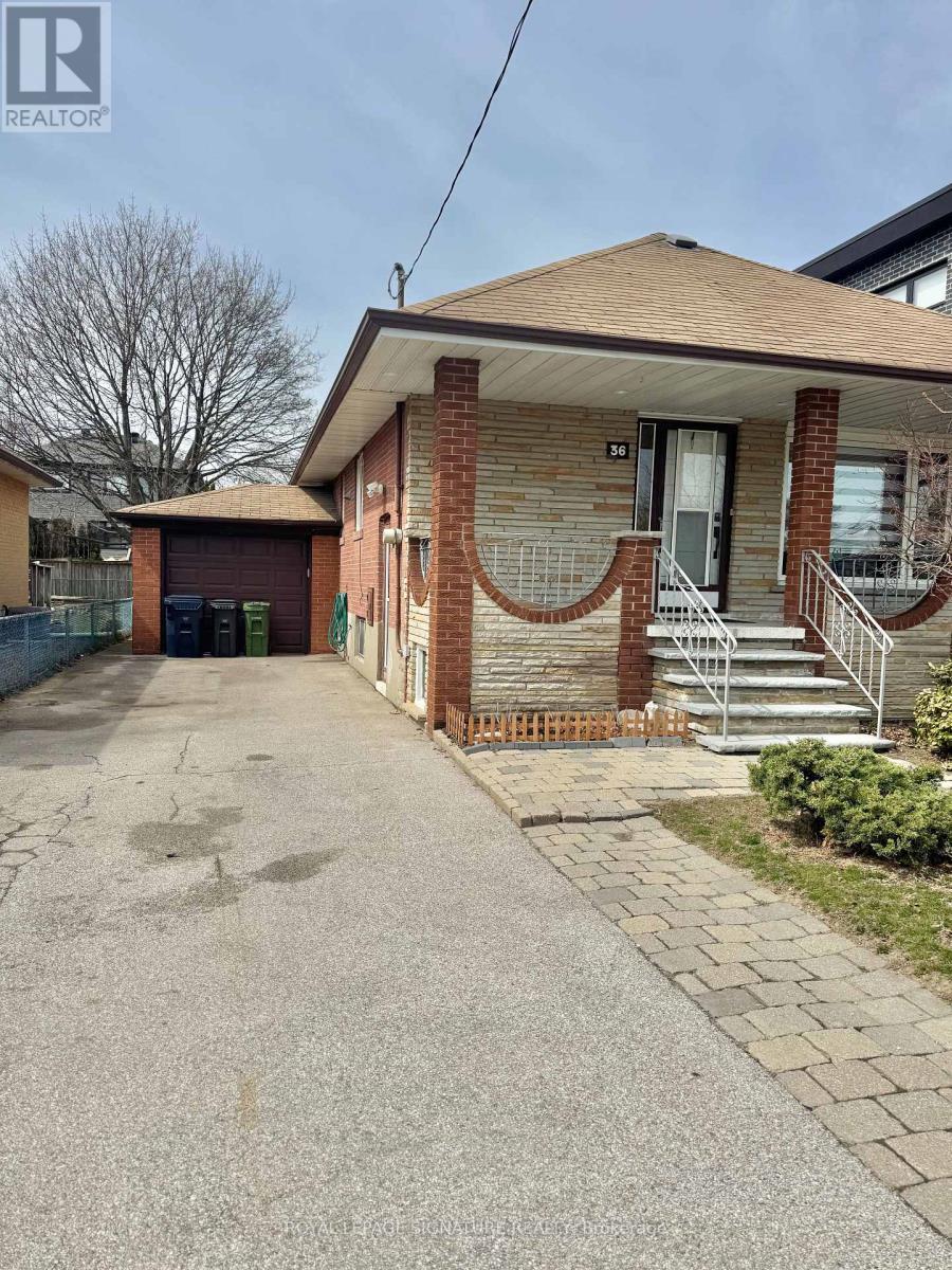 A house with a driveway in front of it.