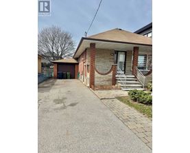 A house with a driveway in front of it.