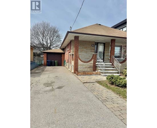 A house with a driveway in front of it.