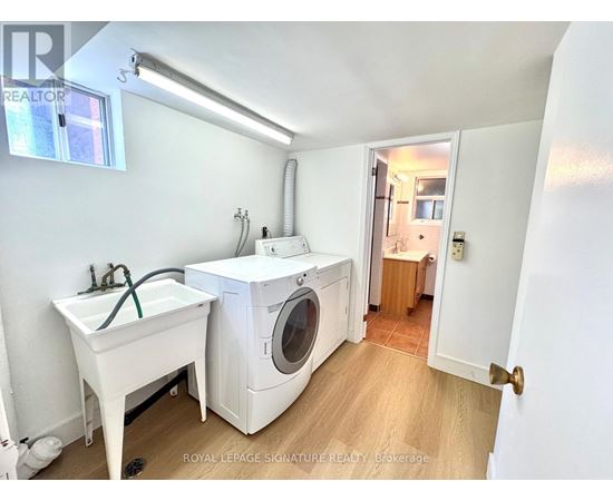 A laundry room with a washer and dryer.