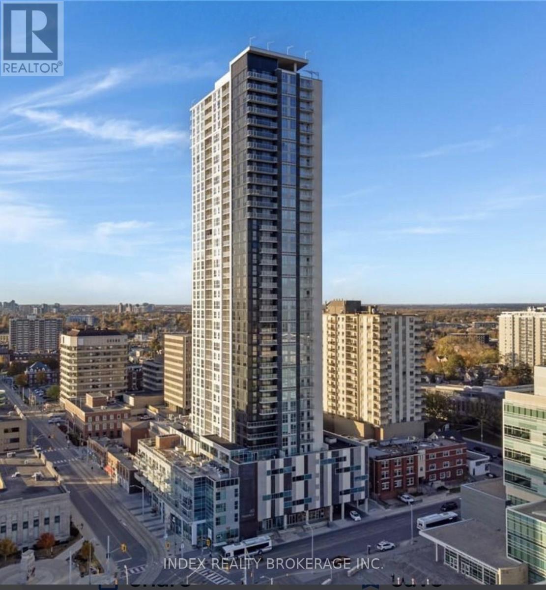 A tall building with many windows is the main focus of the image.