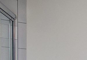 a bathroom with two sinks and a shower and a toilet
