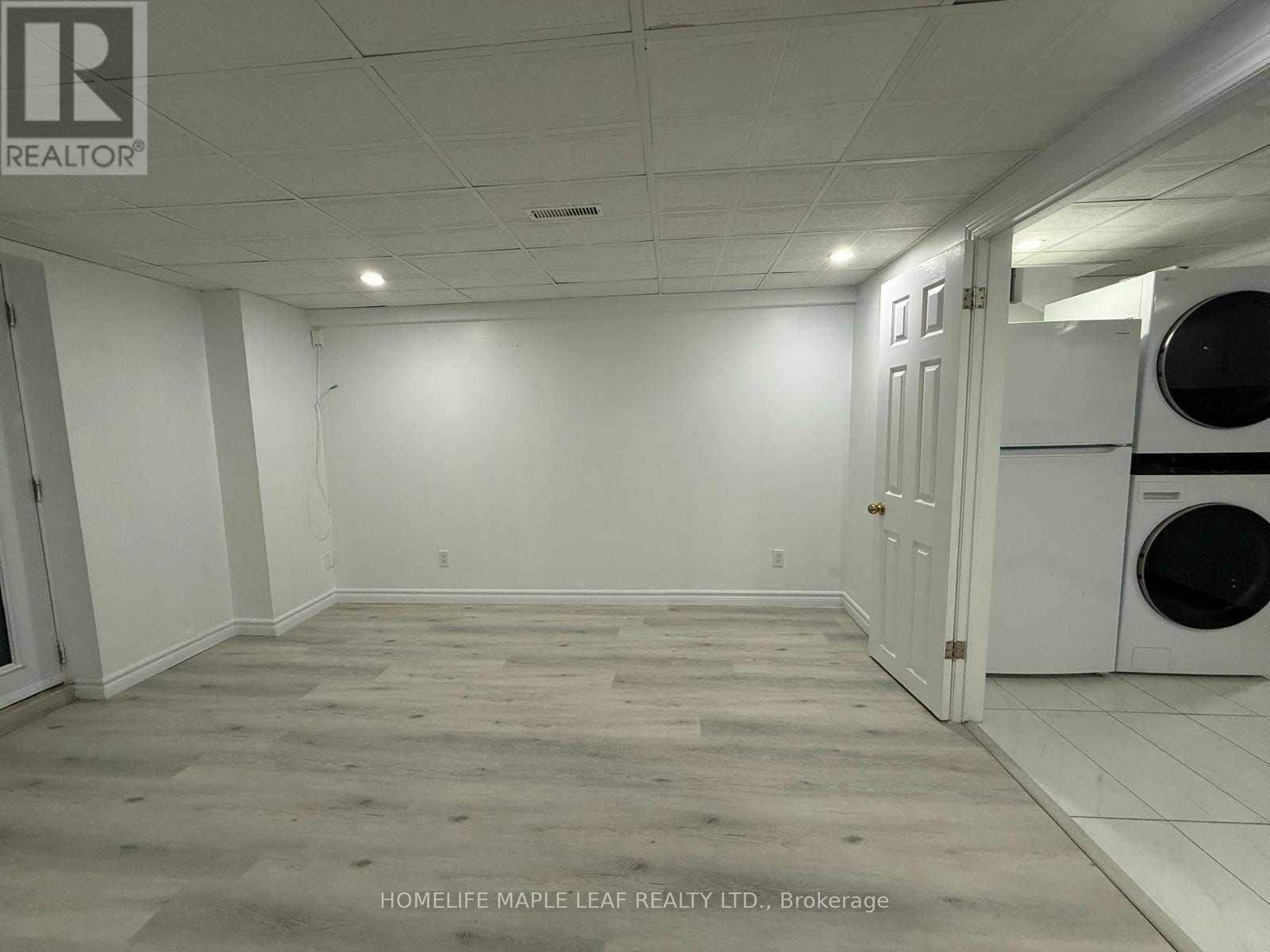 A room with a washing machine in it.