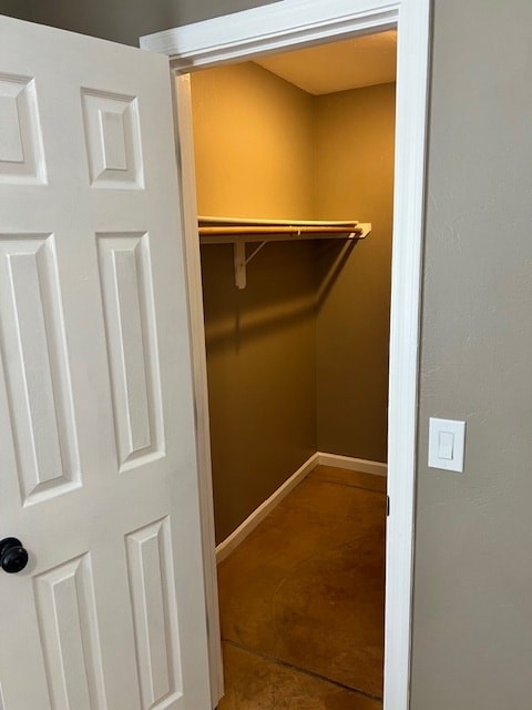 A white door is open to a small pantry.