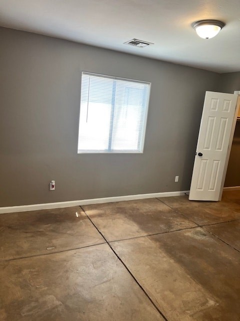 A room with a white door and a window with blinds.