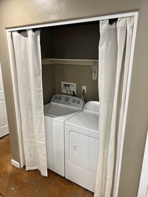 A washer and dryer are in a small, enclosed space.