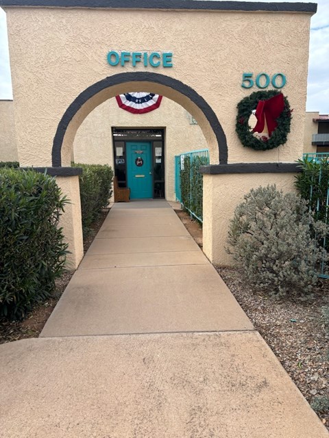 A pathway leads to a door under a sign that says Office 500.