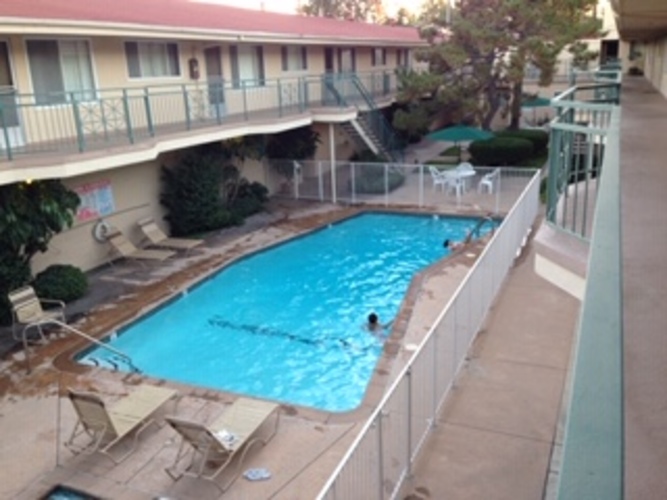 A pool with people swimming in it.