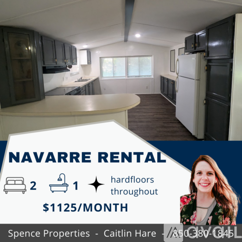 A rental sign for a property with two bedrooms and one bathroom is displayed in a kitchen and living room.