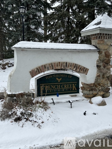 A sign that says Townhomes of French Creek.