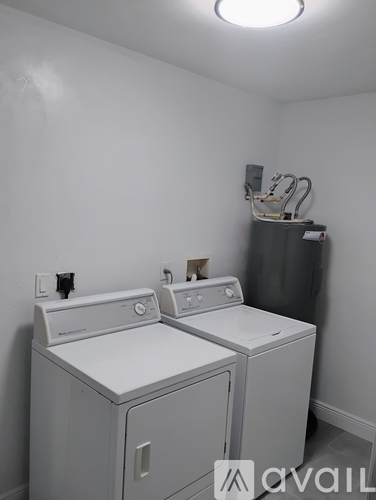 A laundry room with a washer and dryer.