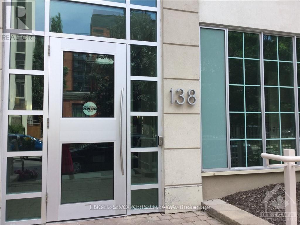 A white door with the number 138 on the wall next to it.
