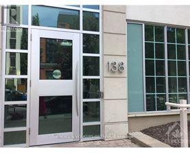 A white door with the number 138 on the wall next to it.