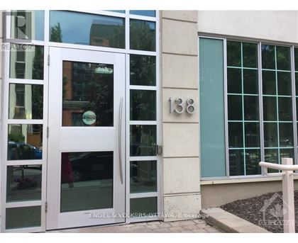 A white door with the number 138 on the wall next to it.