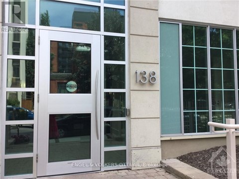 A white door with the number 138 on the wall next to it.
