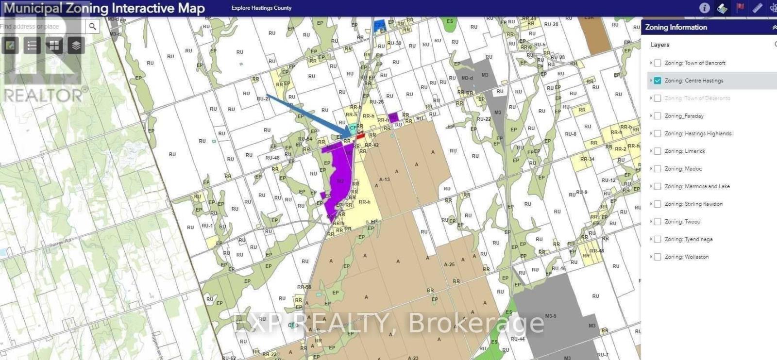 A map with a purple highlighted area and a blue arrow pointing to a specific location.