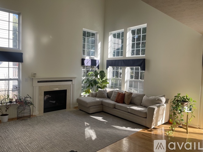 A living room with a fireplace and a couch.