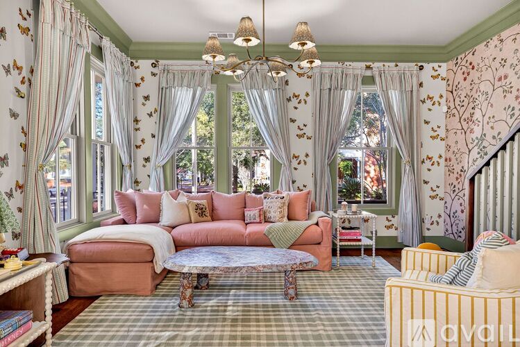 A living room with a sofa, a table, and a couch.