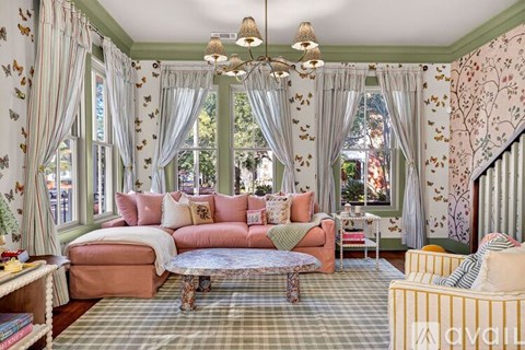 A living room with a sofa, a table, and a couch.