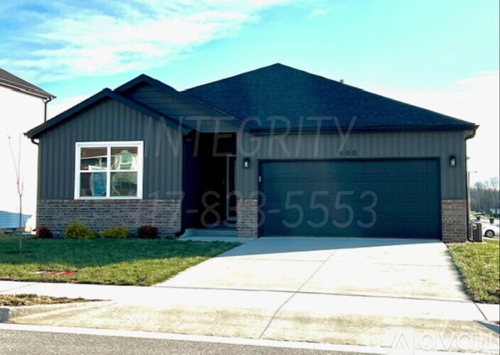 A house with a garage door numbered 8-5553.